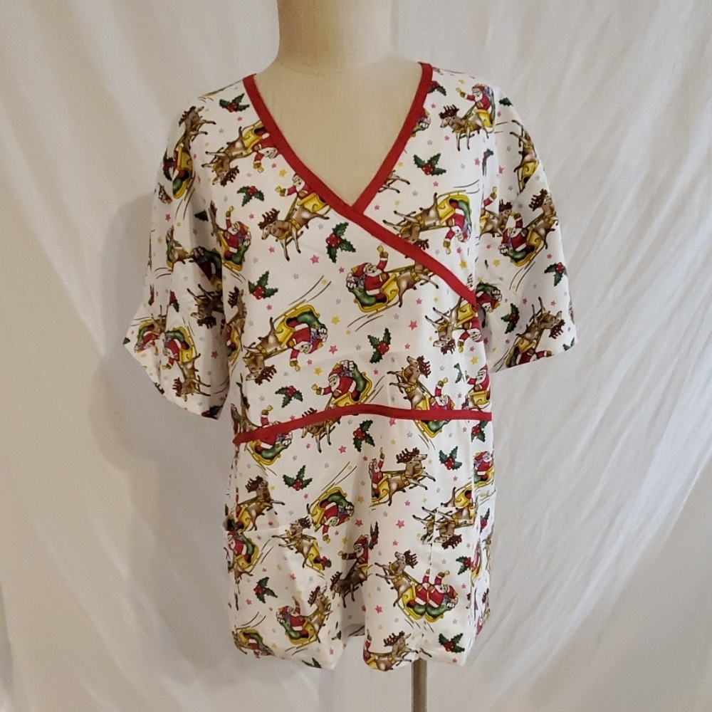 Peppermint scrubs Top flying santa and reindeers